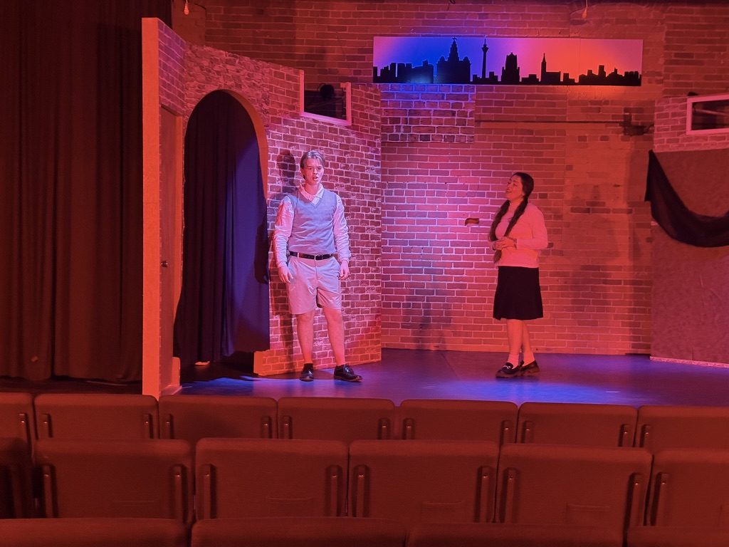 Empty stage, brick and red glow